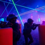 Engaged players in a thrilling laser tag match showcasing excitement and neon lights.